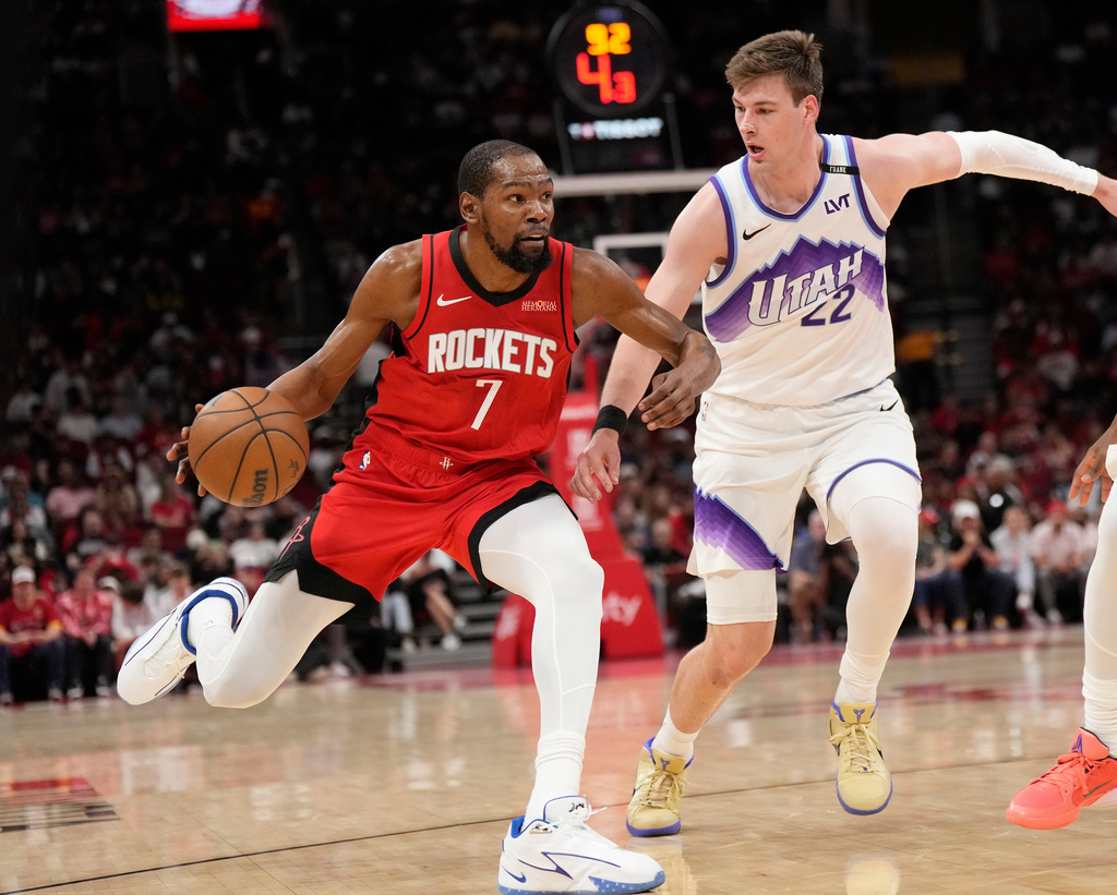 Houston Rockets forward Kevin Durant (7) controls the ball against Utah Jazz forward Kyle Filipowski (22) during the first half of an NBA basketball game, Friday, April 3, 2026, in Houston. (AP Photo/Karen Warren)