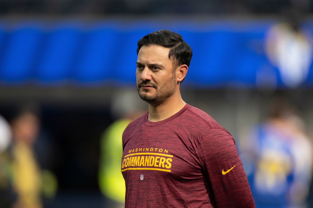 FILE - Washington Commanders quarterbacks coach Tavita Pritchard watches his players before an NFL football game against the Los Angeles Rams, Dec. 17, 2023, in Inglewood, Calif. (AP Photo/Kyusung Gong, File)