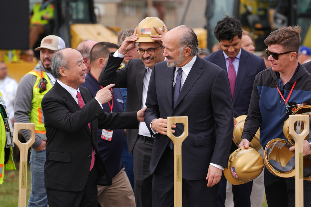 Masayoshi Son, Chairman and CEO of SoftBank Group Corp., left, and Howard Lutnick, Secretary of Commerce speak at a groundbreaking for a new data center Friday, March 20, 2026, in Piketon, Ohio. (AP Photo/Joshua A. Bickel)