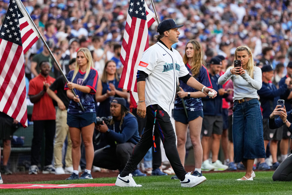 FILE - United States men's national soccer team head coach Mauricio Pochettino walks out to throw out the ceremonial first pitch before a baseball game between the Seattle Mariners and the Toronto Blue Jays, July 3, 2026, in Seattle. (AP Photo/Lindsey Wasson, File)