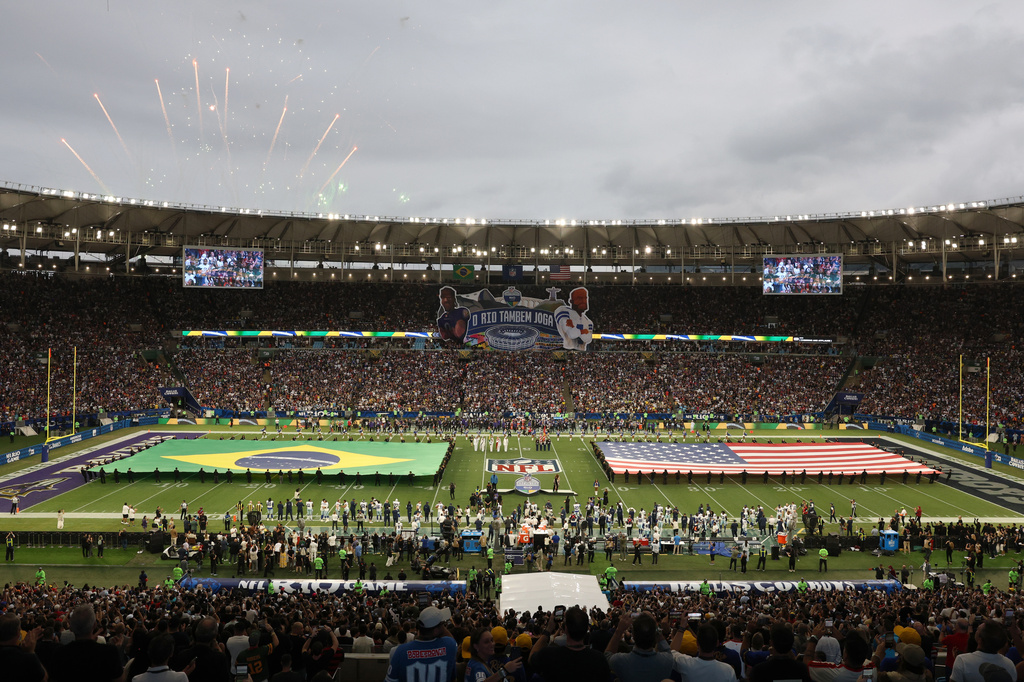 The Brazilian Flag and the United States flag are unfurled during the singing of the Brazilian national anthem before Dallas Cowboys and Baltimore Ravens NFL Game in Rio de Janeiro, Sunday, September 27, 2026. (AP Photo/Gregory Payan)