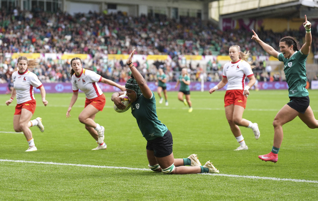 Ireland's Grace Moore scores their fifth try during the Women's Rugby World Cup 2025 Pool C match between Ireland and Spain at Franklin's Gardens, Northampton, England, Sunday Aug. 31, 2025. (Joe Giddens/PA via AP)