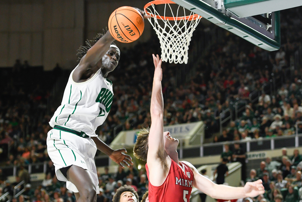 Ohio forward Kiir Kuany (17) blocks a shot by Miami (Ohio) guard Peter Suder (5) during the first half of an NCAA college basketball game, Friday, March 6, 2026, in Athens, Ohio. (AP Photo/HG Biggs)