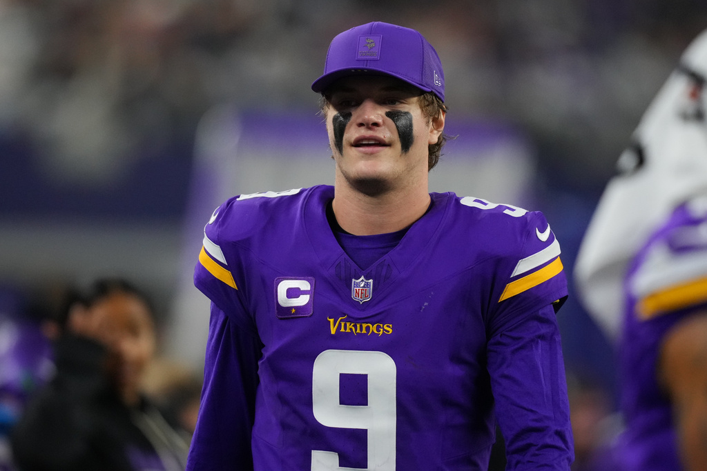 Minnesota Vikings quarterback J.J. McCarthy looks on during the second half of an NFL football game against the Dallas Cowboys Sunday, Dec. 14, 2025, in Arlington, Texas. (AP Photo/Julio Cortez)