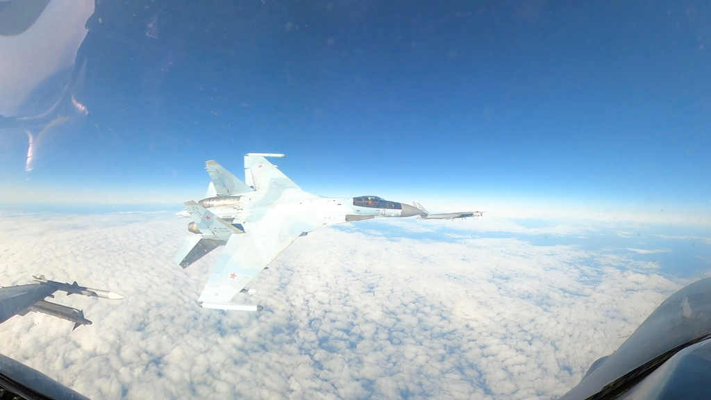 FILE - In this Sept. 23, 2024, image taken from video, a U.S. Air Force F-16 operating under the direction of North American Aerospace Defense Command, conducts a routine intercept of a Russian Tu-95 aircraft in the Alaskan Air Defense Identification Zone (ADIZ) when NORAD said a Russian Su-35 aircraft conducts an unsafe maneuver directed at the F-16. (Department of Defense via AP)
