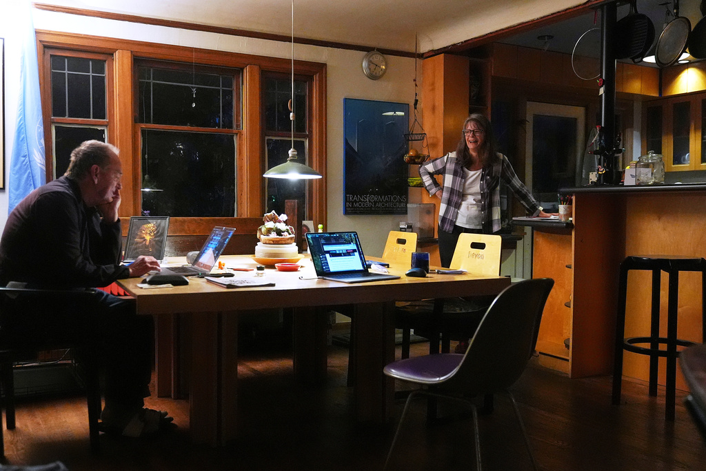 Mary E. Brunkow and her husband Ross Colquhoun talk with one of their daughters on the phone about her winning a Nobel Prize in medicine for part of her work on peripheral immune tolerance, in Seattle, Monday, Oct. 6, 2025. (AP Photo/Lindsey Wasson)