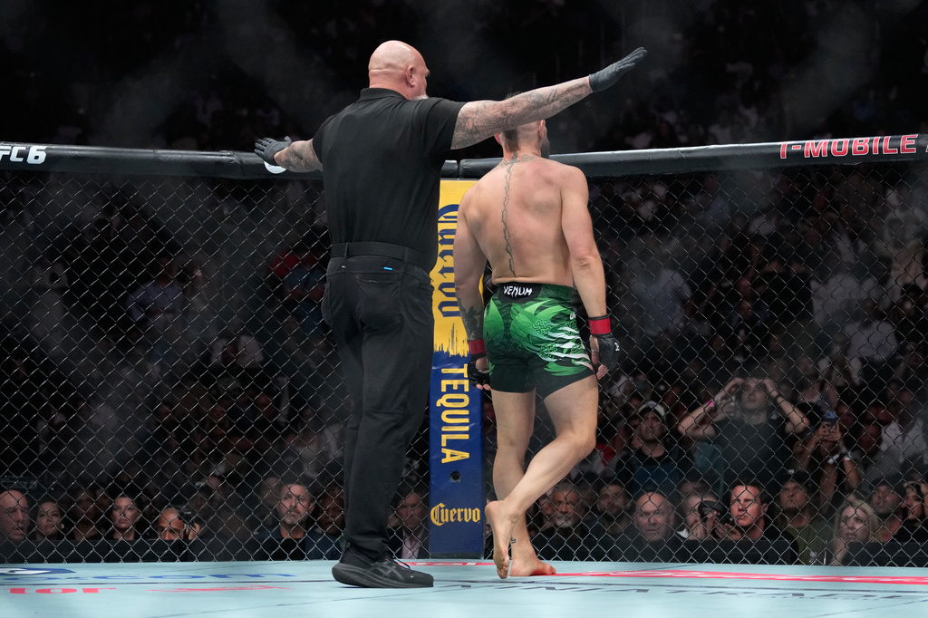 Conor McGregor reacts after he lost to Max Holloway in a welterweight fight at the UFC 329 mixed martial arts event Saturday, July 11, 2026, in Las Vegas. (AP Photo/John Locher)