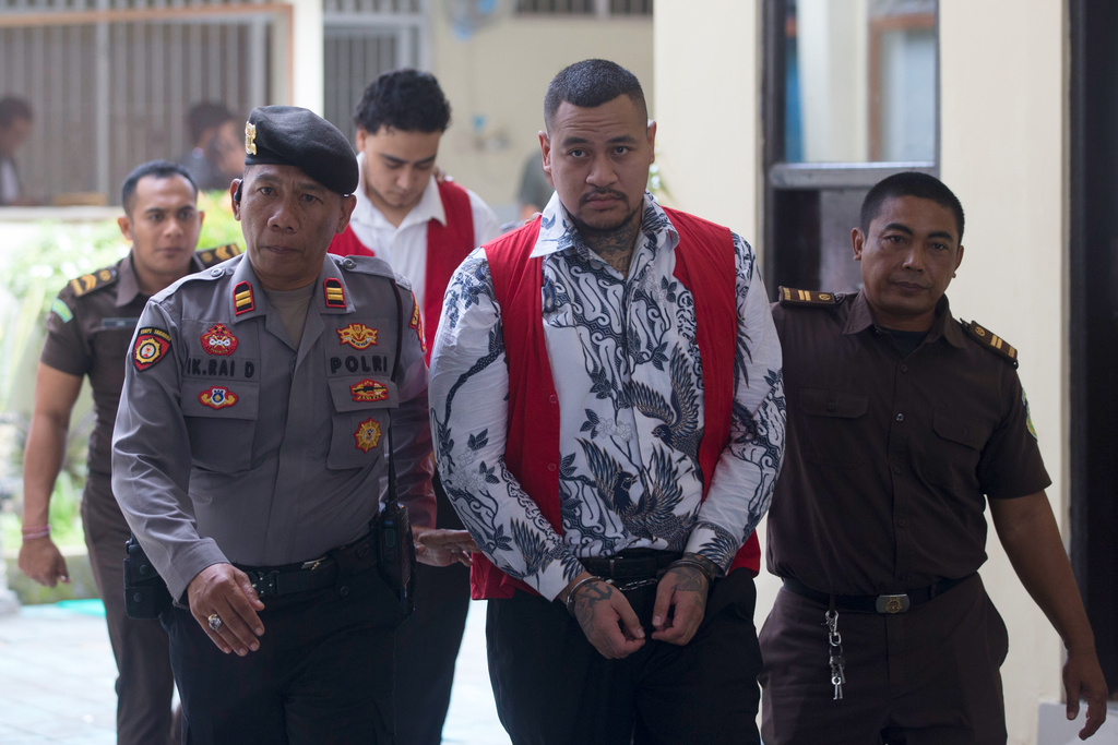 Australian nationals Paea I Middlemore Tupou, foreground center and Mevlut Coskun, rear, who are on trial for the fatal shooting of an Australian tourist last year, arrive for their sentencing hearing at the district Court in Denpasar, Bali, Indonesia, Monday, March 9, 2026. (AP Photo/Firdia Lisnawati)