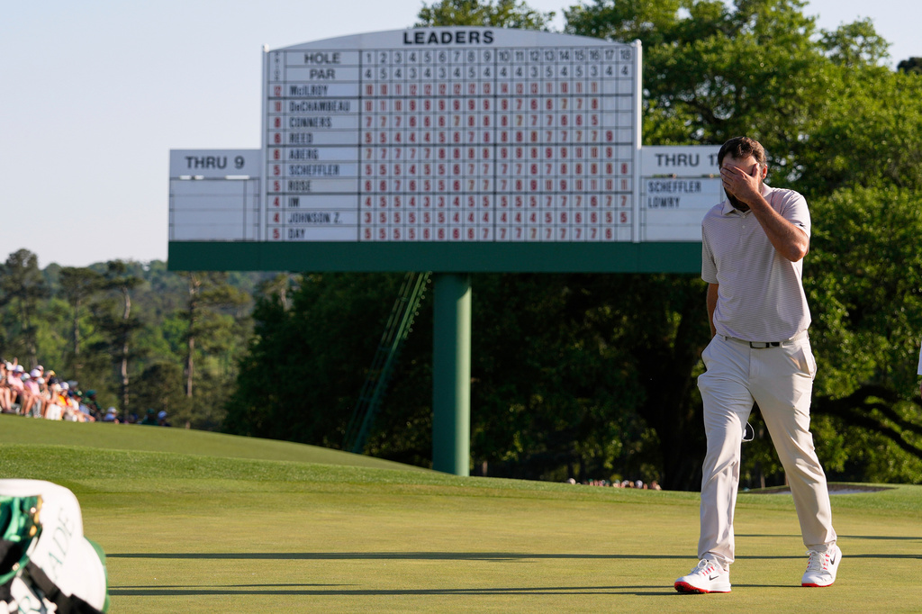 FILE - Scottie Scheffler walks off the green on the 18th hole during the final round at the Masters golf tournament, Sunday, April 13, 2025, in Augusta, Ga. (AP Photo/David J. Phillip, File)