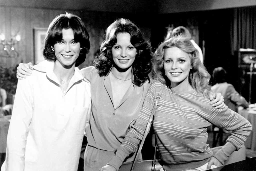 FILE - Cast members Kate Jackson, from left, Jaclyn Smith and Cheryl Ladd pose on the set of "Charlie's Angels" in Los Angeles in March 1978. (AP Photo/George Brich, File)