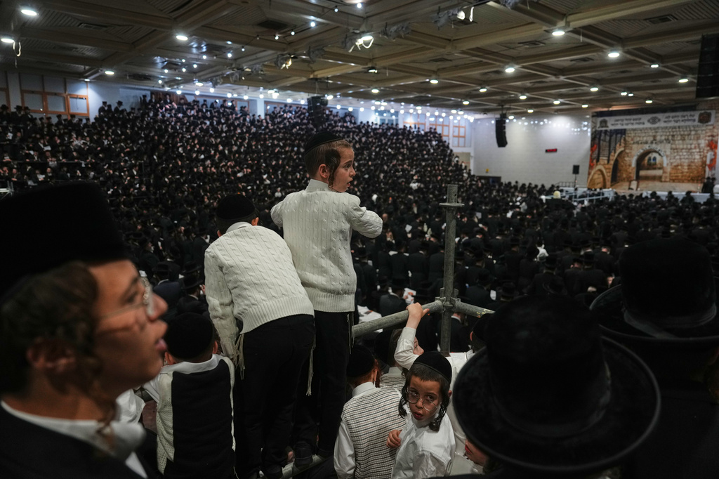 Ultra-Orthodox Jews celebrate the holiday of Lag BaOmer, traditionally marked by bonfire, music, and communal celebrations, in Netanya, Israel, Monday, May 4, 2026. (AP Photo/Ariel Schalit)