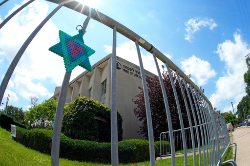 FILE - A Star of David hands from a fence outside the dormant landmark Tree of Life synagogue in Pittsburgh's Squirrel Hill neighborhood on July 13, 2023. (AP Photo/Gene J. Puskar/File) FILE - A Star of David hands from a fence outside the dormant landmark Tree of Life synagogue in Pittsburgh's Squirrel Hill neighborhood on July 13, 2023. (AP Photo/Gene J. Puskar/File)