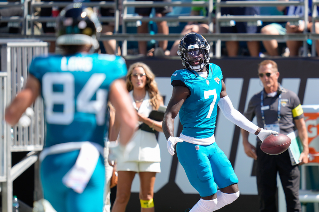Jacksonville Jaguars wide receiver Brian Thomas Jr. (7) reacts in the endzone after catching a pass for a touchdown an NFL football game against the Seattle Seahawks, Sunday, Oct. 12 2025, in Jacksonville, Fla. (AP Photo/John Raoux)