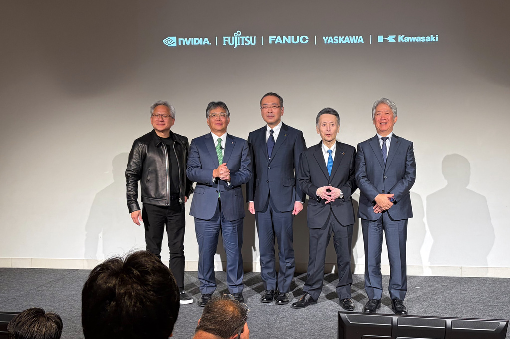 From left, Nvidia CEO Jensen Huang, Fujitsu CEO Takahito Tokita, Fanuc CEO Kenji Yamaguchi, Yaskawa CEO Masahiro Ogawa and Kawasaki Heavy CEO Yasuhiko Hashimoto pose for the media at an event to announce a new initiative in Tokyo, Thursday, July 16, 2026. (AP Photo/Yuri Kageyama)