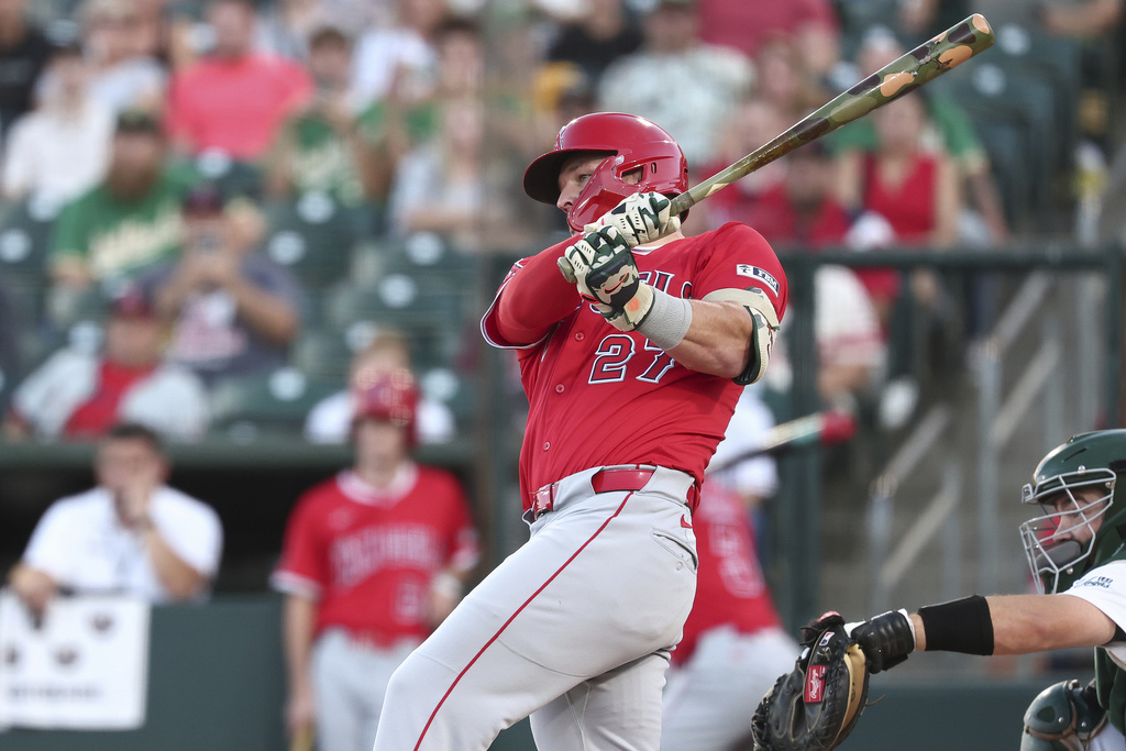 Los Angeles Angels' Mike Trout hits a single during the first inning of a baseball game against the Athletics, Saturday, Aug. 16, 2025, in West Sacramento, Calif. (AP Photo/Sara Nevis)