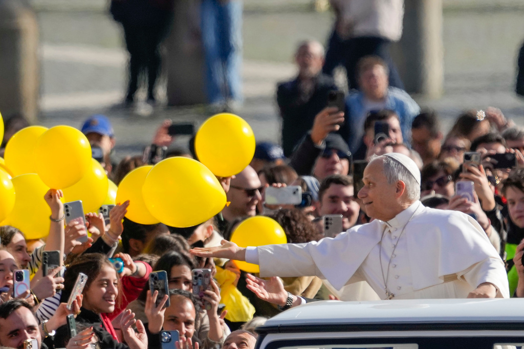 Pope Leo XIV arrives in St. Peter's Square at the Vatican for his open-air weekly general audience, Wednesday, Feb. 18, 2026. (AP Photo/Gregorio Borgia)