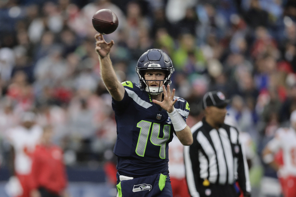 Seattle Seahawks quarterback Sam Darnold (14) throws during the first half of an NFL preseason football game against the Kansas City Chiefs, Friday, Aug. 15, 2025, in Seattle. (AP Photo/John Froschauer)