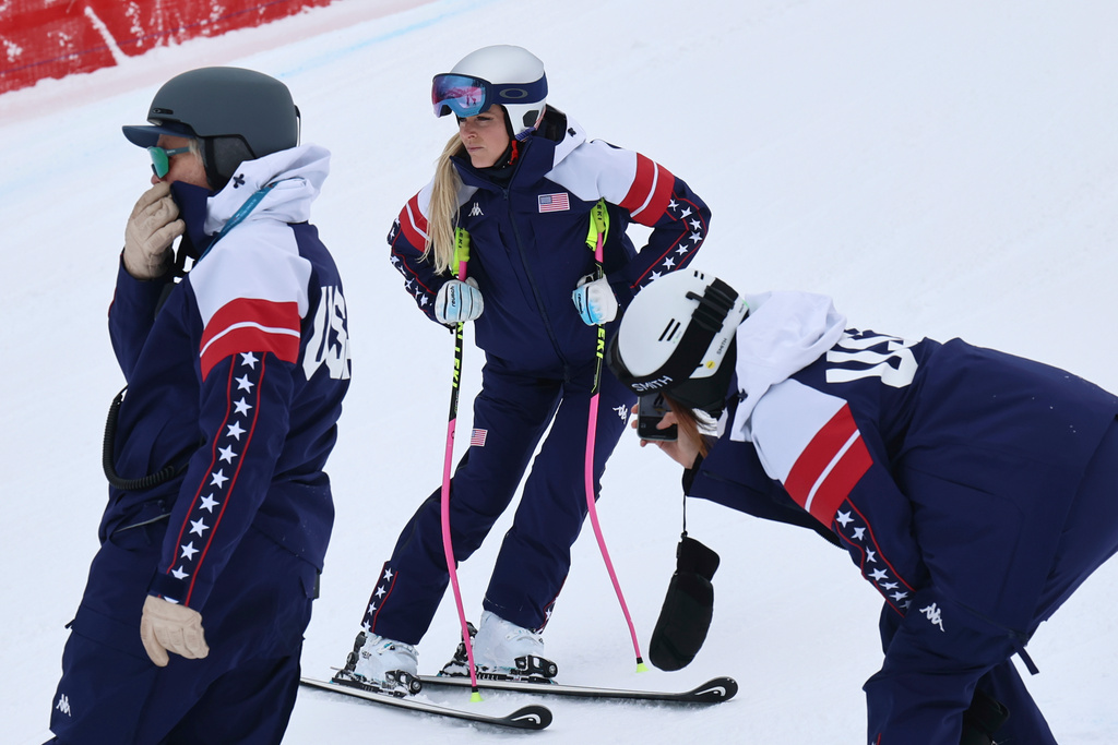 United States' Lindsey Vonn, center, concentrates ahead of an alpine ski, women's downhill official training, at the 2026 Winter Olympics, in Cortina d'Ampezzo, Italy, Friday, Feb. 6, 2026. (AP Photo/Marco Trovati)