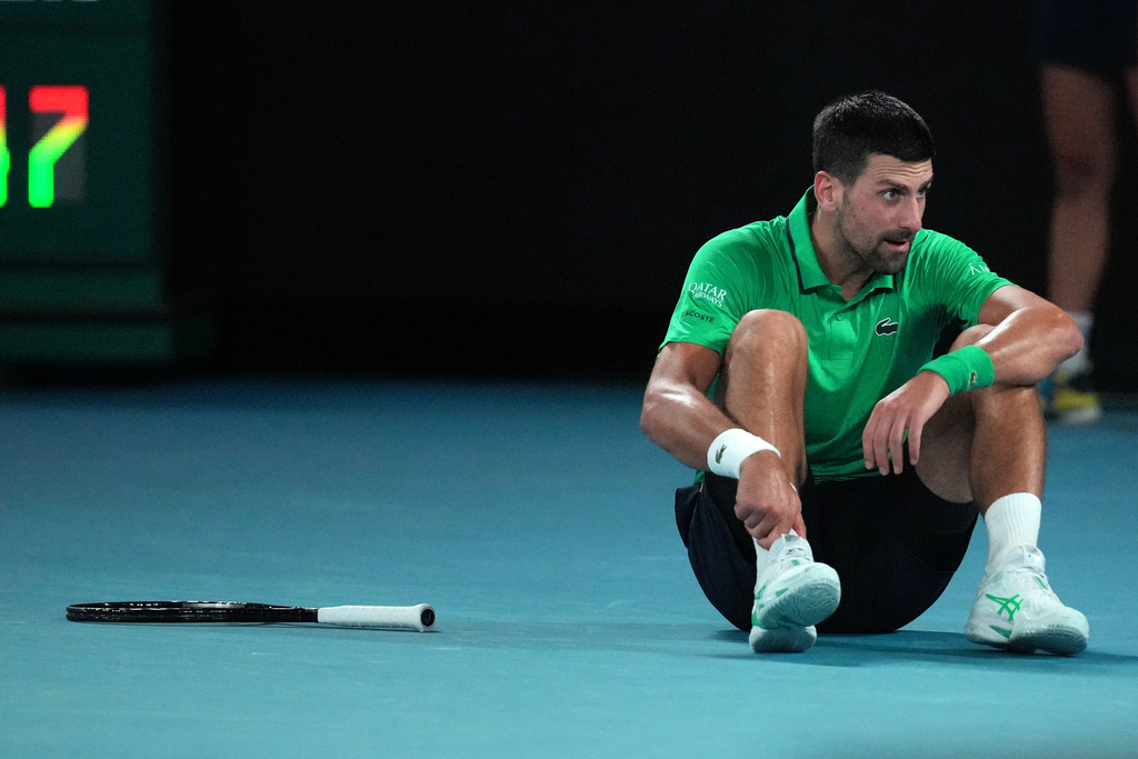 Novak Djokovic of Serbia reacts after a fall during his third round match against Botic van de Zandschulp of the Netherlands at the Australian Open tennis championship in Melbourne, Australia, Saturday, Jan. 24, 2026. (AP Photo/Dita Alangkara)
