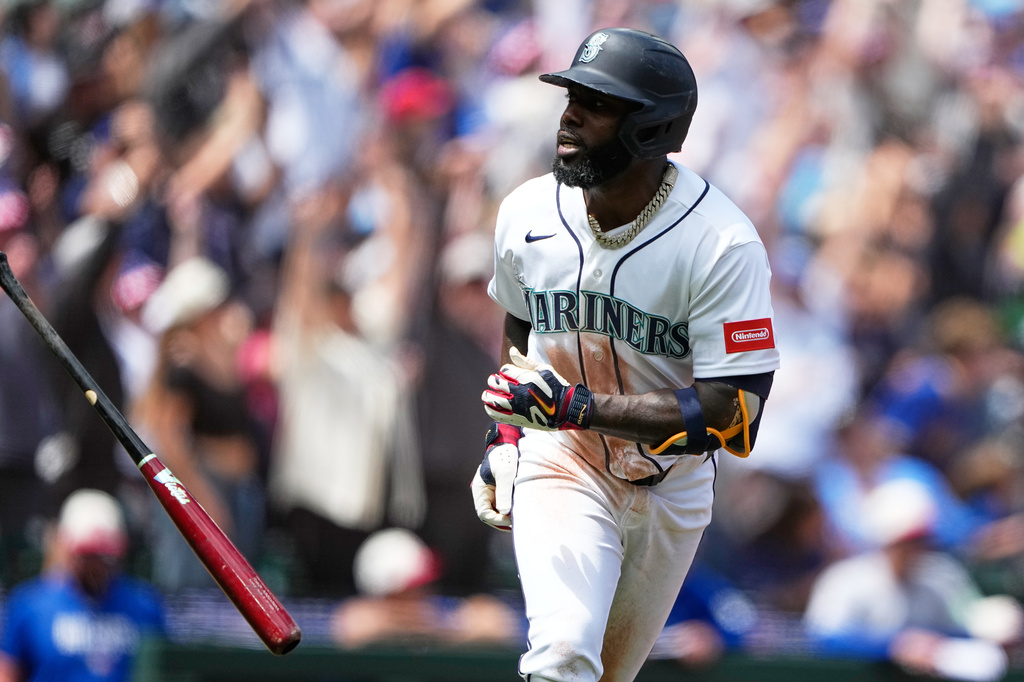 Seattle Mariners' Randy Arozarena reacts after hitting a grand slam against the Toronto Blue Jays during the second inning of a baseball game, Saturday, July 4, 2026, in Seattle. (AP Photo/Lindsey Wasson)