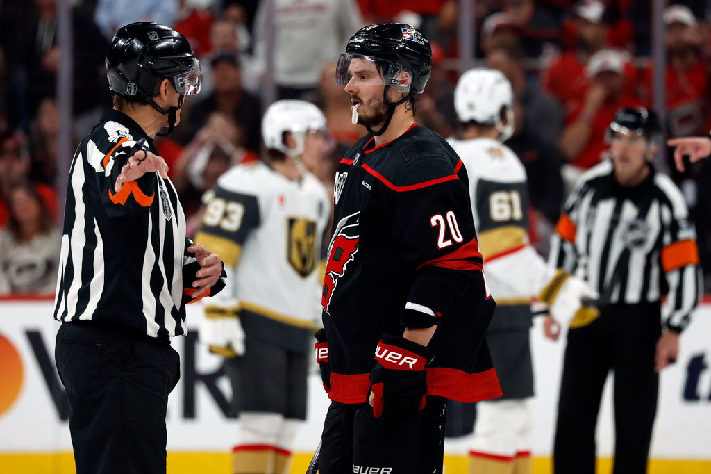Carolina Hurricanes' Sebastian Aho (20) gets an explanation from an official during the second period in Game 1 of the NHL hockey Stanley Cup Final series against the Vegas Golden Knights in Raleigh, N.C., Tuesday, June 2, 2026. (AP Photo/Karl DeBlaker)