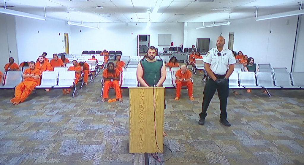 Hisham Abugharbieh, facing two counts of first-degree murder appears in court via video on Saturday, April 25, 2026 in Tampa, Fla. (WFTS-TV via AP)