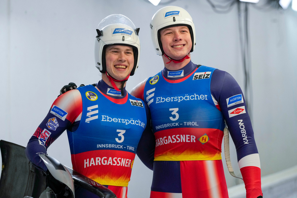 FILE - Marcus Mueller, right, and Ansel Haugsjaa, of the United States, pose after the men's sprint race at the Luge World Cup in Igls near Innsbruck, Austria, Dec. 7, 2024. (AP Photo/Matthias Schrader, File)