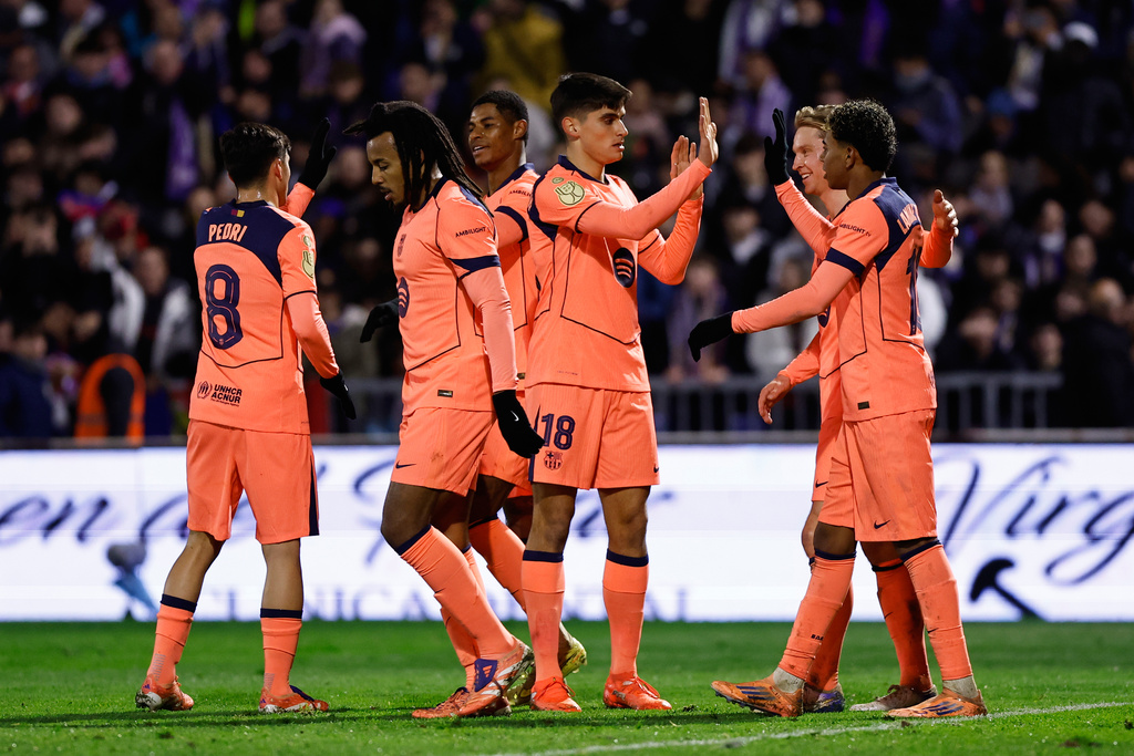 Barcelona's Marcus Rashford, third left, celebrates after scoring his side's second goal with his teammates during the Copa del Rey soccer match between Guadalajara and Barcelona in Guadalajara, Spain, Tuesday, Dec. 16, 2025. (AP Photo/Rudy Garcia)