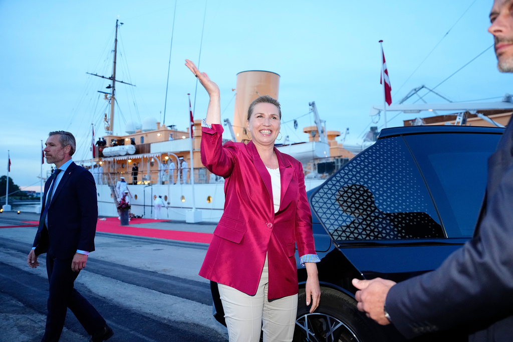 Acting Prime Minister Mette Frederiksen, center, waves on the royal ship Dannebrog on Monday, June 1, 2026, as the royal ship Dannebrog is docked at Odense Harbor. (Sebastian Elias Uth/Ritzau Scanpix via AP)