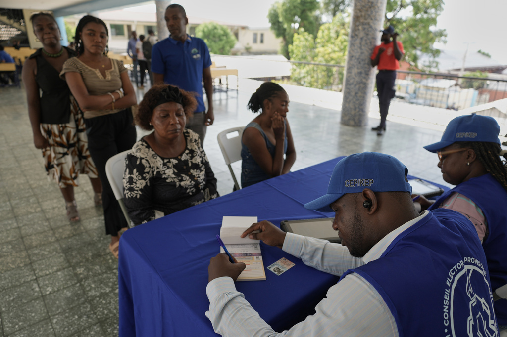 Haitians register to vote in the upcoming general election in Port-au-Prince, Haiti, Thursday, July 30, 2026. (AP Photo/Odelyn Joseph)