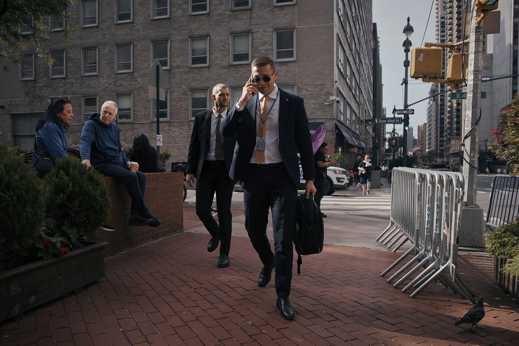 People walk near the United Nations headquarters during the 80th session of the United Nations General Assembly in New York, Sunday, Sept. 21, 2025. (AP Photo/Andres Kudacki)