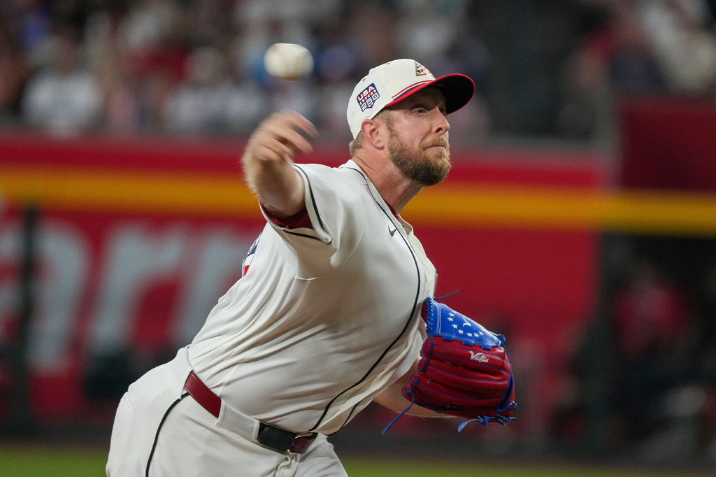Arizona Diamondbacks pitcher Merrill Kelly works against the Milwaukee Brewers during the first inning of an baseball game Saturday, July 4, 2026, in Phoenix. (AP Photo/Darryl Webb)