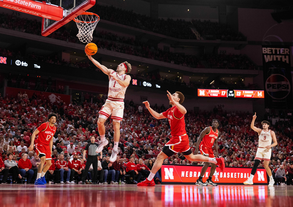 Nebraska's Sam Hoiberg (1) shoots against Maryland's Elijah Saunders (13) during the first half of an NCAA college basketball game Wednesday, Feb. 25, 2026, in Lincoln, Neb. (AP Photo/Rebecca S. Gratz)