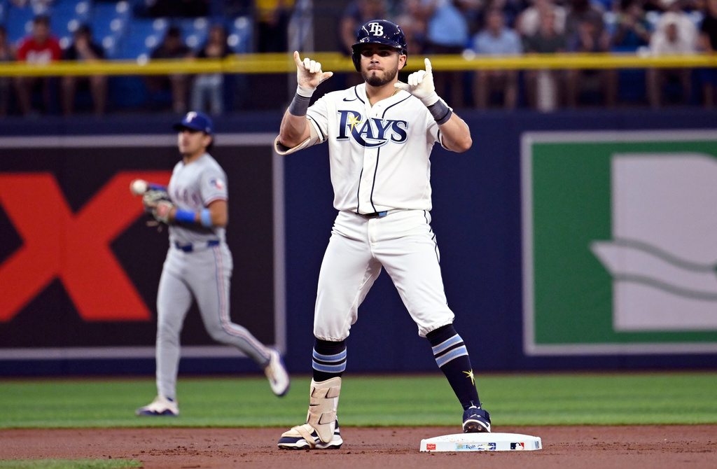 Tampa Bay Rays' Jonathan Aranda celebrates after his double during the third inning of a baseball game against the Texas Rangers Wednesday, July 29, 2026, in St. Petersburg, Fla. (AP Photo/Jason Behnken)