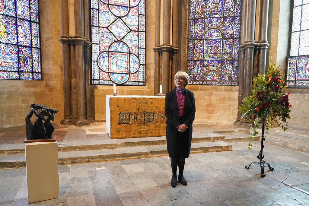 Sarah Mullally, the new Archbishop of Canterbury, spiritual leader of the world's 85 million Anglicans, poses for the media inside Canterbury Cathedral in Canterbury, England, Friday, Oct. 3, 2025. (AP Photo/Alberto Pezzali)