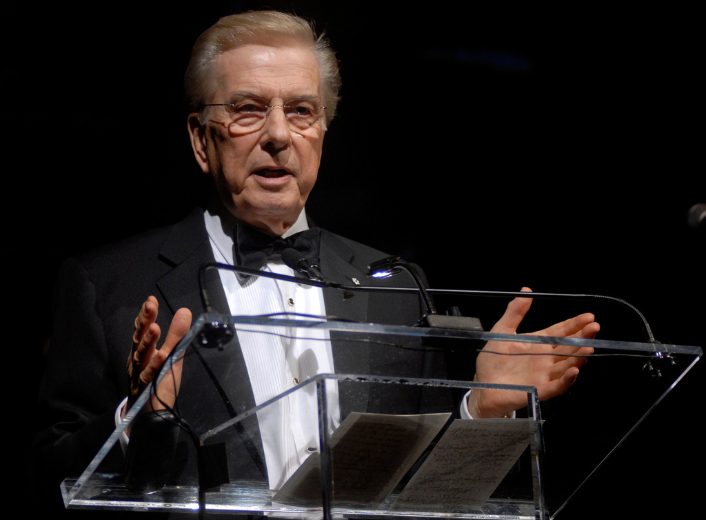 FILE - Lloyd Robertson, Chief News Anchor and Senior News Editor of Canada's CTV News, speaks in New York at the annual Canadian Association of New York dinner on Nov. 17, 2006 after receiving the organization's 2006 Arts and Letters Award. (AP Photo/John Smock, File)