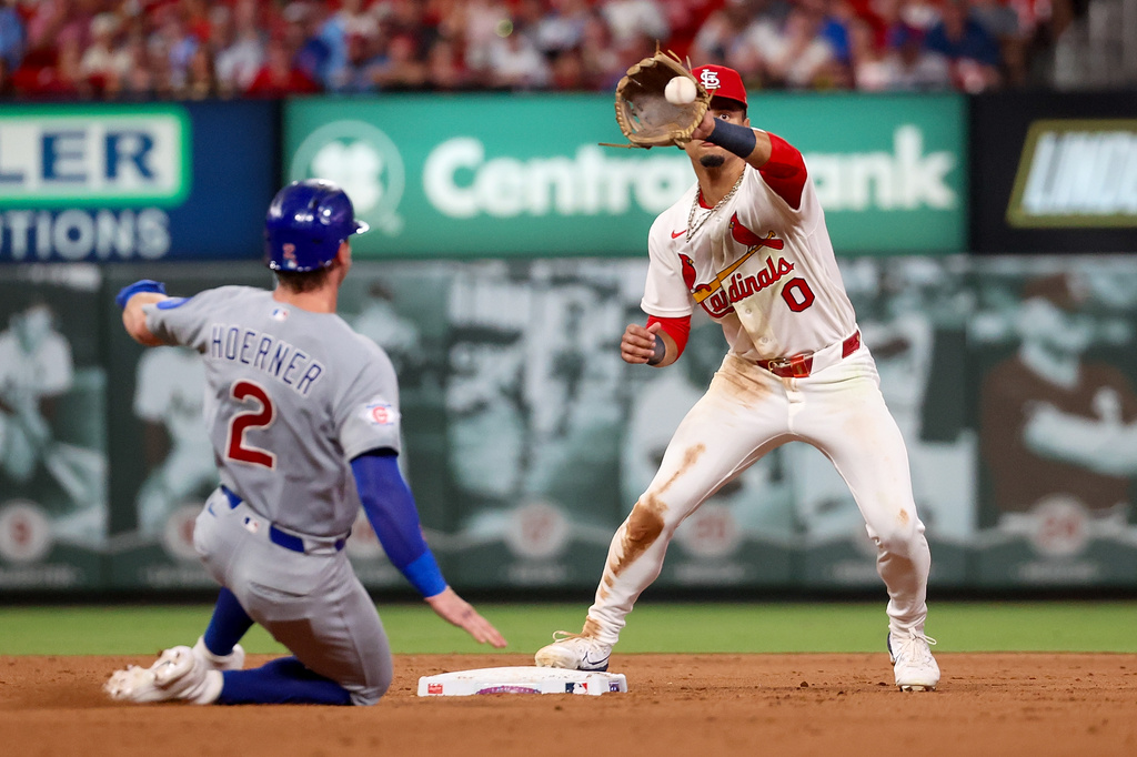St. Louis Cardinals' Masyn Winn (0) catches the ball for an out against Chicago Cubs' Nico Hoerner (2) during the fifth inning of a baseball game Monday, July 27, 2026, in St. Louis. (AP Photo/Scott Kane)