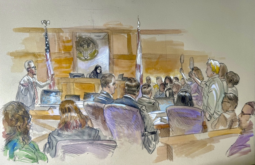 This courtroom sketch shows Ryan Routh, left, making his statement to the jury as prospective jurors hold up paddles indicating that they want to be heard to be excused during the trial of Routh, who is charged with attempting to assassinate Donald Trump last year at a golf course in South Florida, Monday, Sept. 8, 2025, in Fort Pierce, Fla. (Lothar Speer via AP)