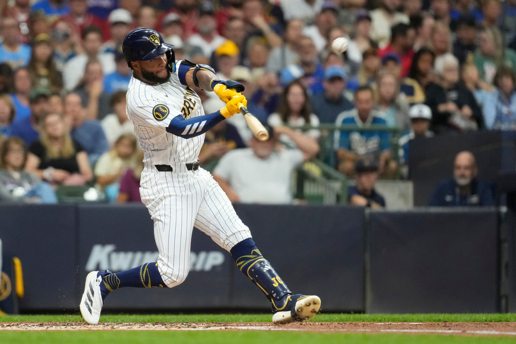 Milwaukee Brewers' Jackson Chourio hits a solo home run during the first inning of a baseball game against the Texas Rangers, Saturday, Aug. 29, 2026, in Milwaukee. (AP Photo/Aaron Gash)