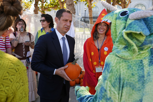 Mayor Daniel Lurie holds a pumpkin at a patch setup for disadvantaged children in front of San Francisco City Hall on Wednesday, Oct. 29, 2025, in San Francisco. (AP Photo/Terry Chea) Mayor Daniel Lurie holds a pumpkin at a patch setup for disadvantaged children in front of San Francisco City Hall on Wednesday, Oct. 29, 2025, in San Francisco. (AP Photo/Terry Chea)
