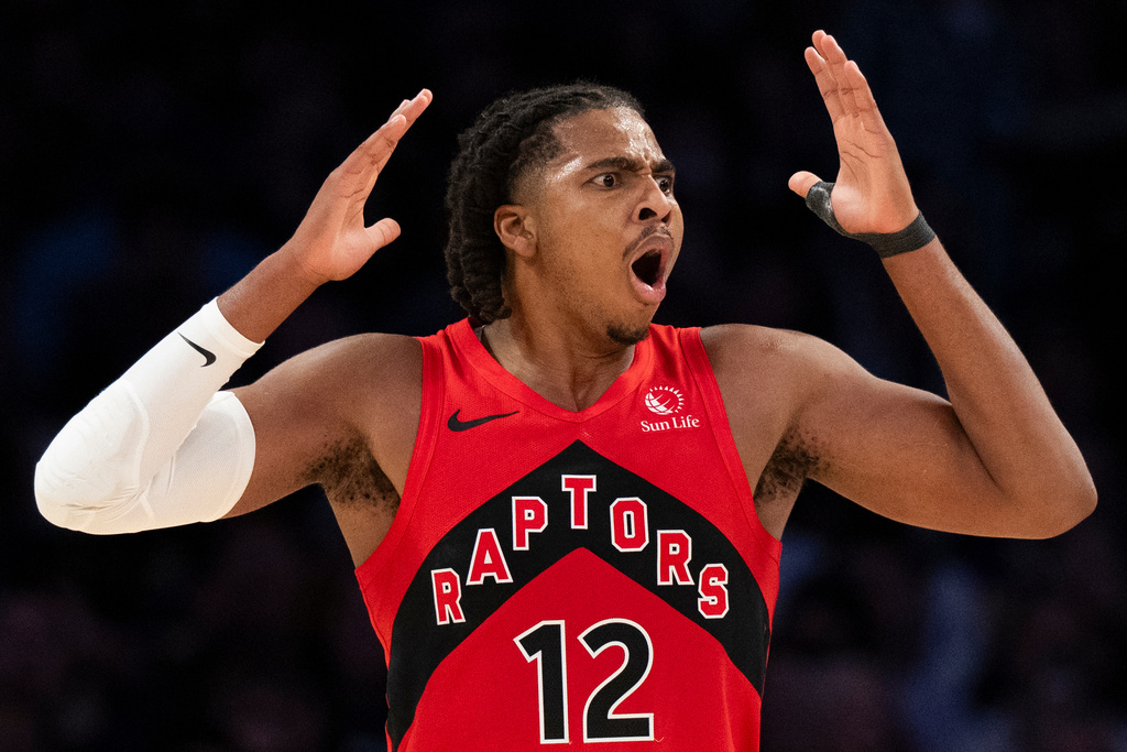 Toronto Raptors forward Collin Murray-Boyles (12) reacts to a call by officials during the first half of an NBA basketball game against the Los Angeles Lakers in Los Angeles, Sunday, Jan. 18, 2026. (AP Photo/Kyusung Gong)