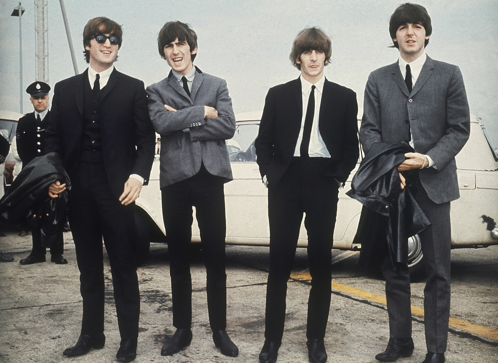 FILE - The Beatles, from left, John Lennon, George Harrison, Ringo Starr and Paul McCartney arrive in Liverpool, England, July 10, 1964. (AP Photo, File)