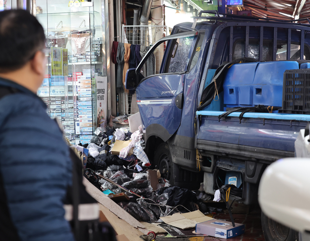 A truck crashes at a market in Bucheon, South Korea, Thursday, Nov. 13, 2025. (Jeon Jin-hwan/Newsis via AP)