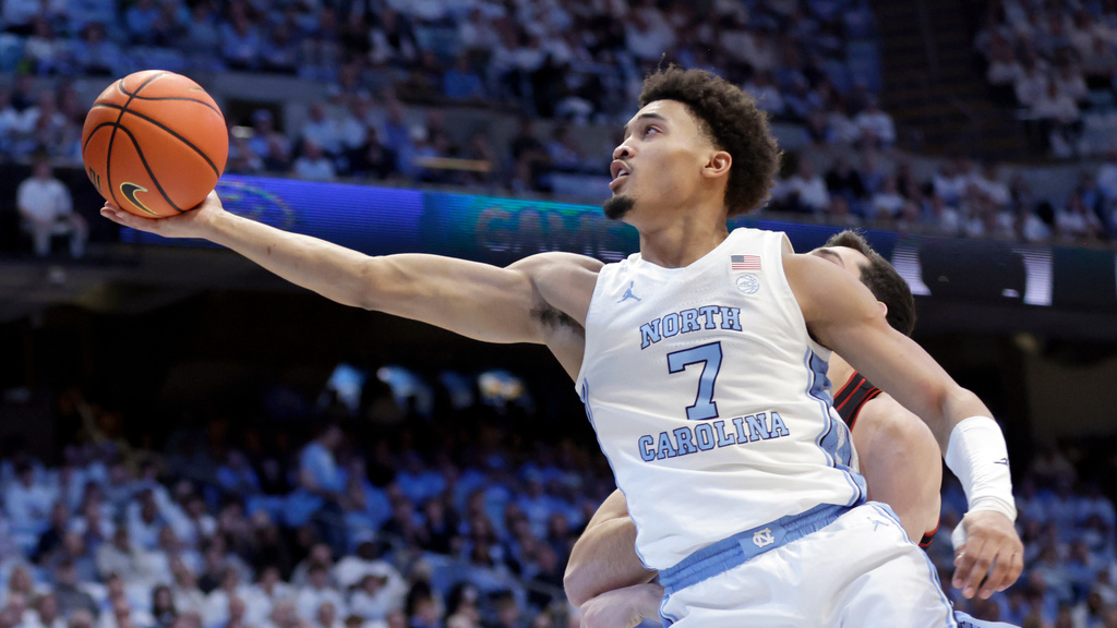 North Carolina guard Seth Trimble (7) drives to the hoop against Louisville during the first half of an NCAA college basketball game Monday, Feb. 23, 2026, in Chapel Hill, N.C. (AP Photo/Chris Seward)