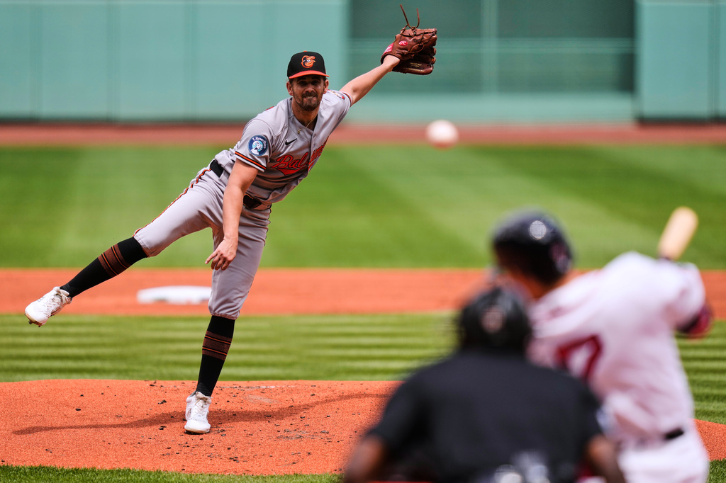Baltimore Orioles starting pitcher Dean Kremer watches as Boston Red Sox's Masataka Yoshida hits a single during the first inning in the first baseball game of a doubleheader, Wednesday, July 22, 2026, in Boston. (AP Photo/Charles Krupa)