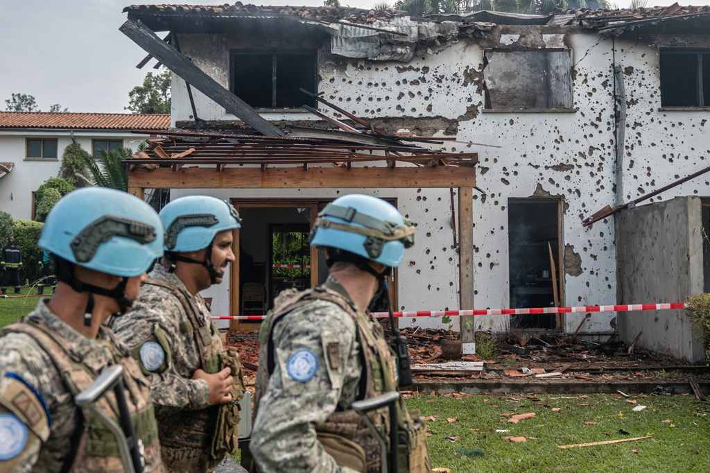 U.N peacekeepers guard a house hit by a drone strike in Goma, Democratic Republic of Congo, Wednesday, March 11, 2026. (AP Photo/Moses Sawasawa)