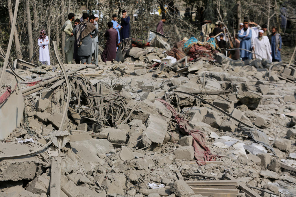 Residents inspect the rubble of a house destroyed in a strike in Patan village, Kunar province, eastern Afghanistan, Monday, Sept. 21, 2026. (AP Photo/Shafiullah Kakar)