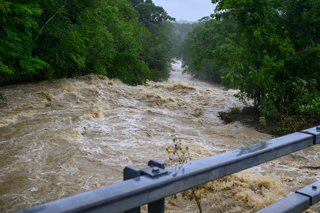 The Muitzes Kill swelled after heavy rainfall on Wednesday, July 29, 2026, in Castleton, N.Y., as torrential rain triggered flash flooding. (Jim Franco/The Albany Times Union via AP)