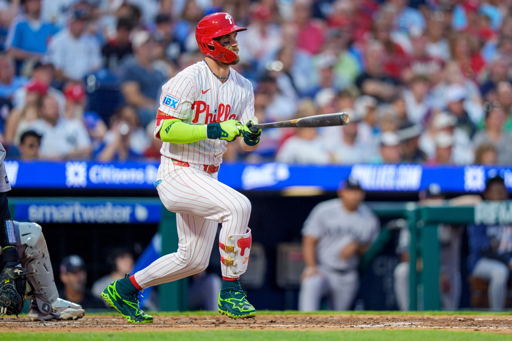 Philadelphia Phillies' Bryce Harper doubles during the third inning of a baseball game against the New York Yankees, Sunday, July 26, 2026, in Philadelphia. (AP Photo/Chris Szagola)