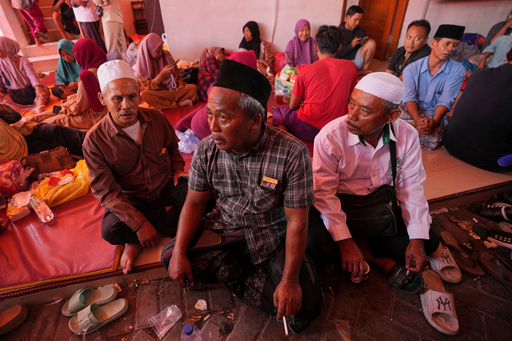 Mohammad Solehoddin, center, whose son has not been accounted for after a building under construction collapsed Monday at an Islamic boarding school, waits with other family members as rescue efforts are underway, in Sidoarjo, East Java, Indonesia, Thursday, Oct. 2, 2025. (AP Photo/Achmad Ibrahim) Mohammad Solehoddin, center, whose son has not been accounted for after a building under construction collapsed Monday at an Islamic boarding school, waits with other family members as rescue efforts are underway, in Sidoarjo, East Java, Indonesia, Thursday, Oct. 2, 2025. (AP Photo/Achmad Ibrahim)